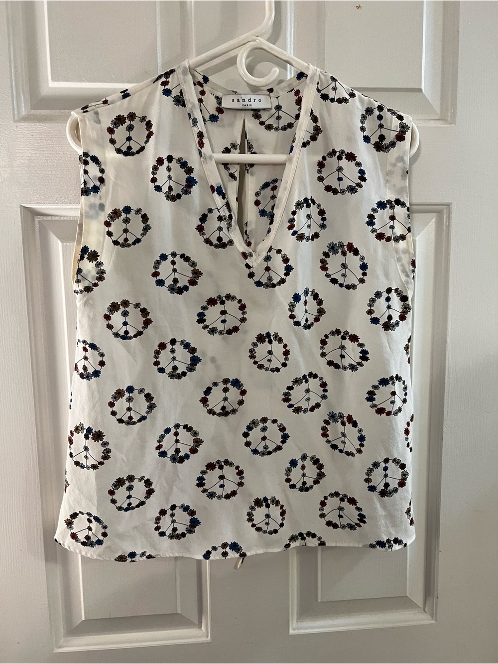 Sandro White Sleeveless V-Neck Top with Multicolor Floral Peace Motif